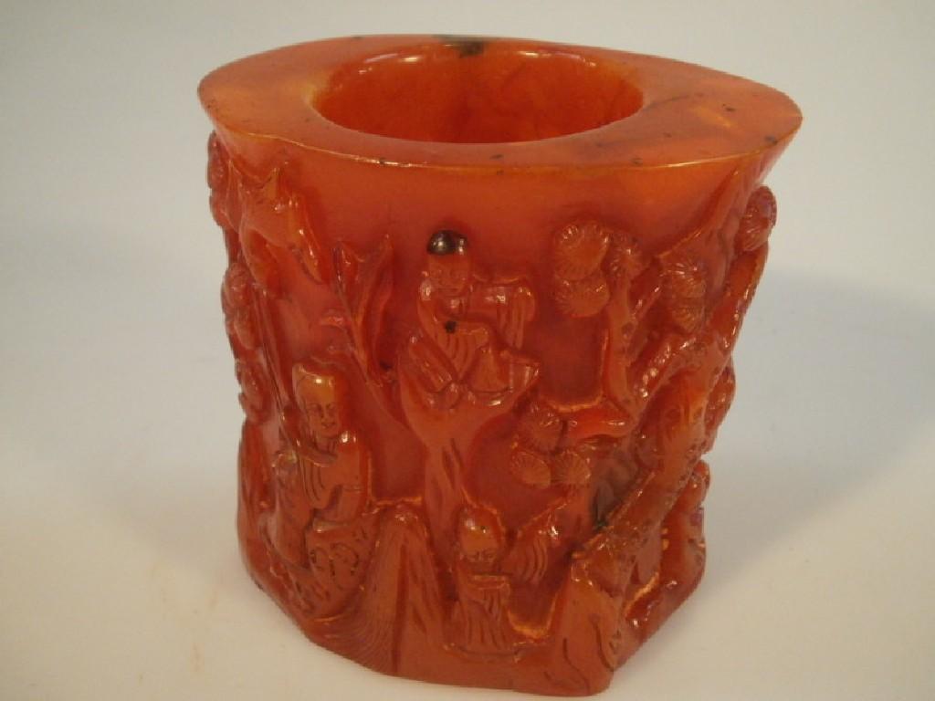 Appraisal: A Chinese reconstituted amber brush pot decorated with figures in