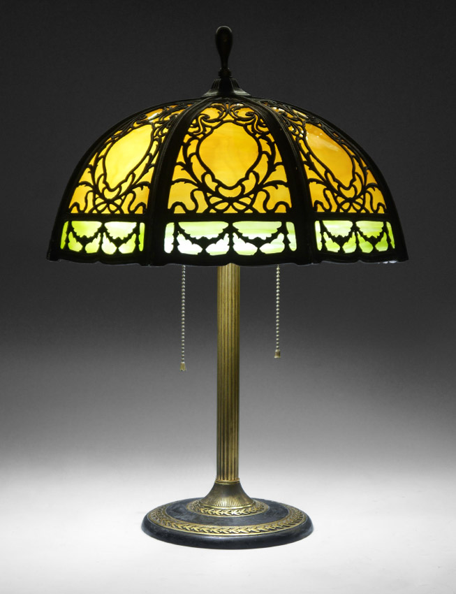 Appraisal: BRADLEY HUBBARD BENT PANEL SLAG GLASS LAMP Cast metal base