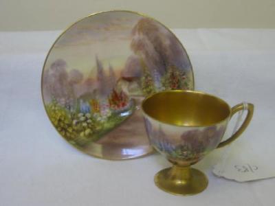 Appraisal: A ROYAL WORCESTER PORCELAIN CUP AND SAUCER painted with foxgloves