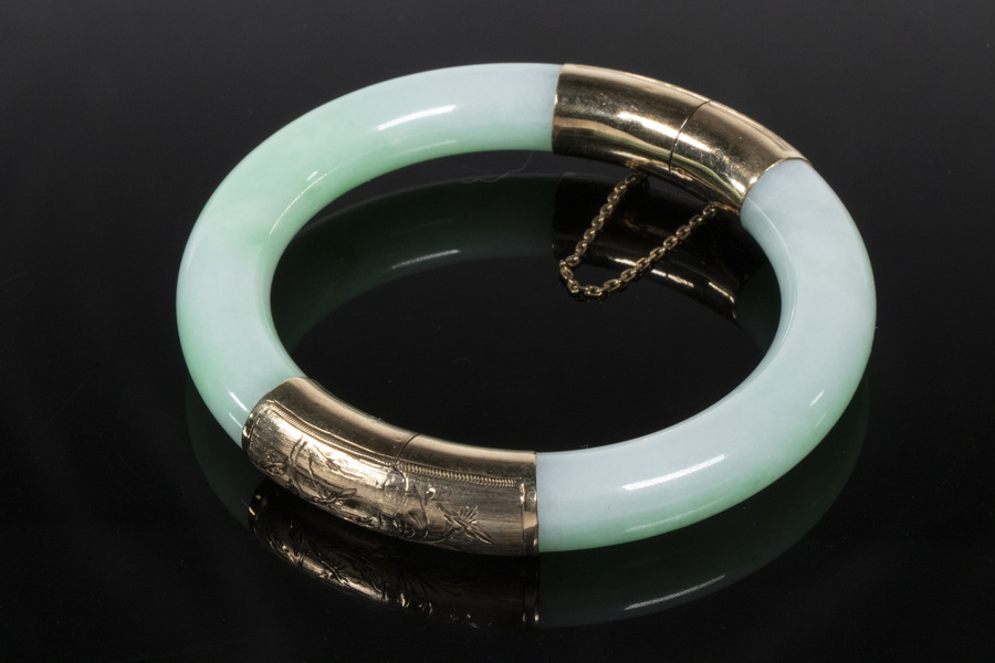 Appraisal: JADEITE BANGLE BRACELET Jadeite and K Yellow Gold floral engraved