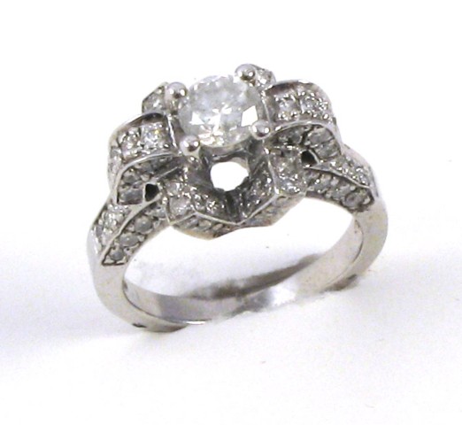 Appraisal: DIAMOND AND FOURTEEN KARAT WHITE GOLD RING centering a round