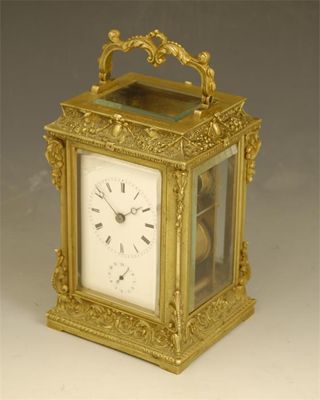 Appraisal: A late th century cast brass carriage clock with alarm