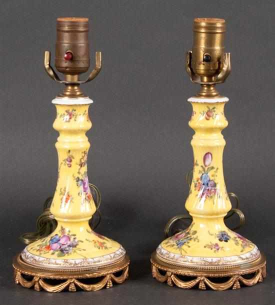 Appraisal: Pair of Dresden floral decorated porcelain candlesticks mounted as lamps