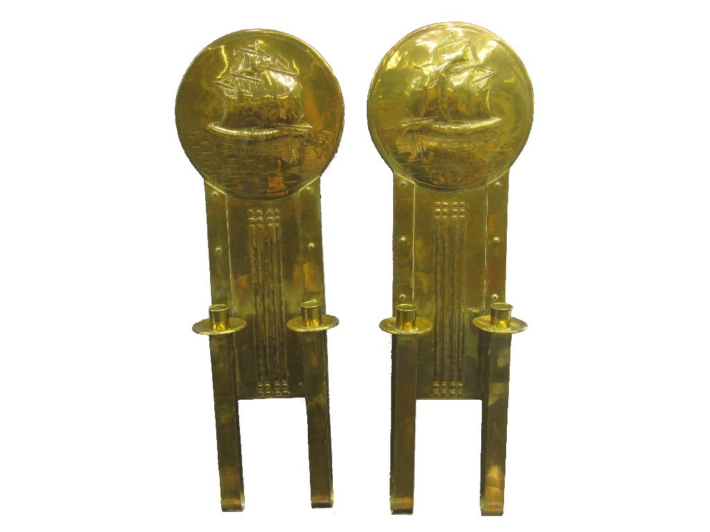 Appraisal: Pair of brass Arts and Crafts wall sconces depicting sailing