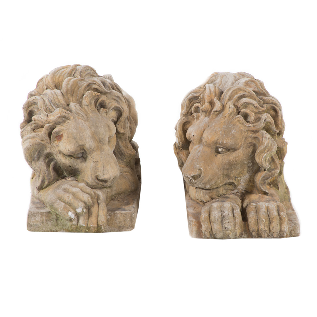 Appraisal: Pair of poured stone lions th century recumbent lions on