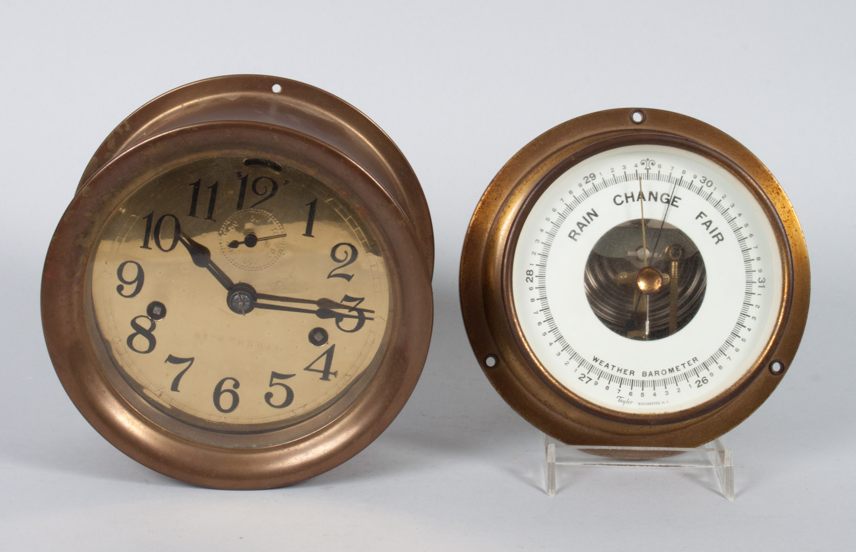 Appraisal: Seth Thomas clock and barometer brass port hole wall clock