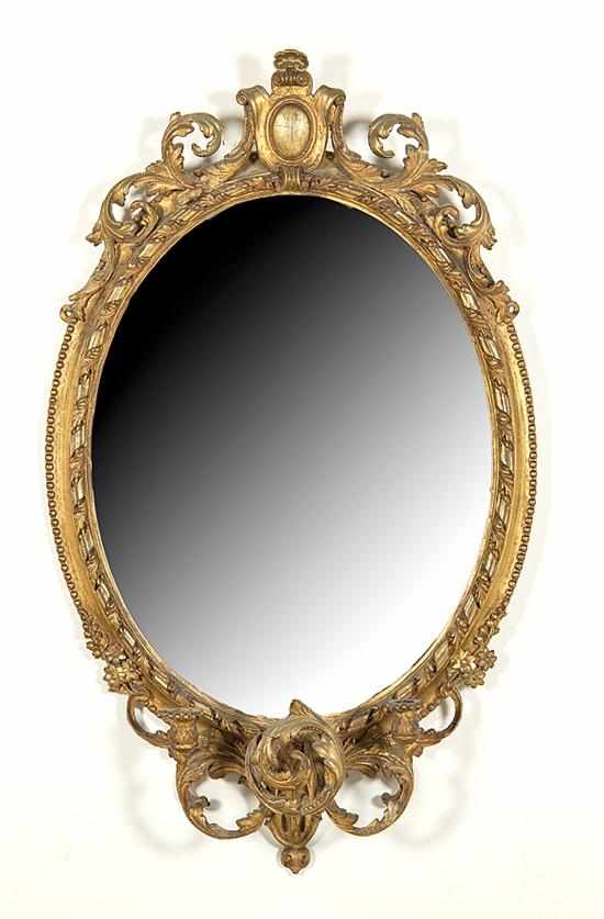 Appraisal: Rococo style giltwood girandole mirror mid th century oval leaf-carved