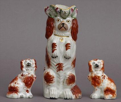 Appraisal: PAIR OF STAFFORDSHIRE SMALL FIGURES OF SPANIELS AND A DOG-FORM