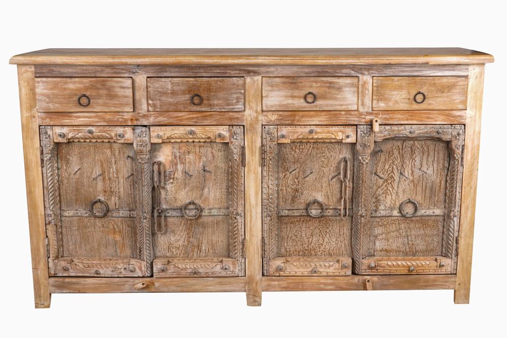 Appraisal: CARVED BLEACHED WOOD SIDEBOARDlate th century with four drawers over