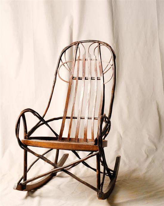 Appraisal: An E th C Twig Rocker with vining back arms