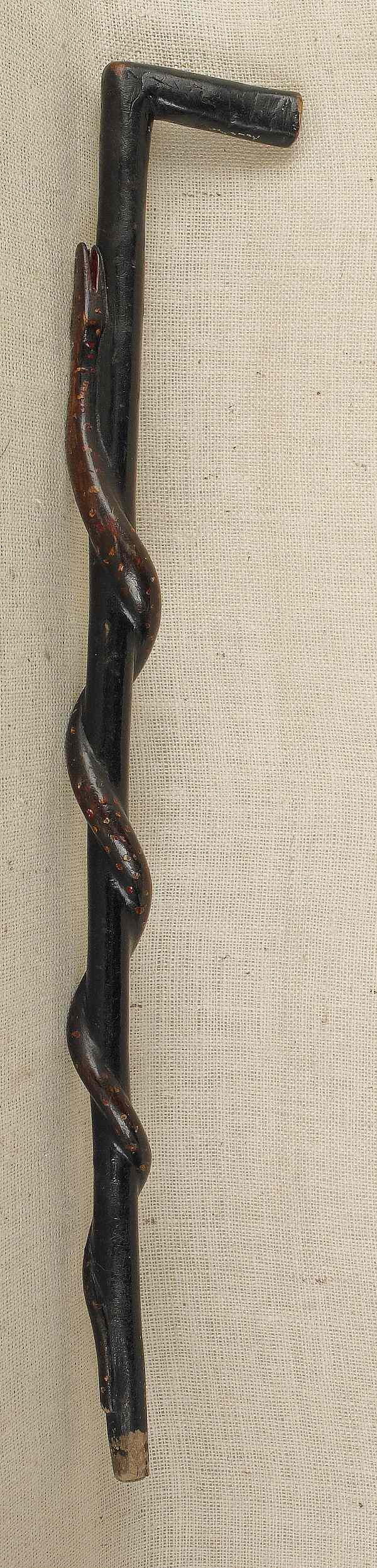 Appraisal: Carved and painted cane with a snake entwined around the