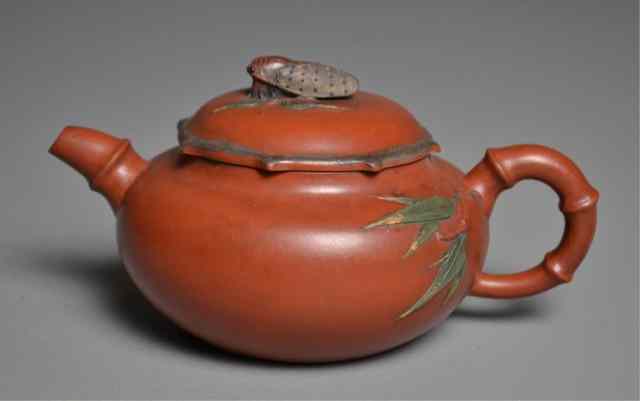 Appraisal: Chinese Yising Teapot with Cicada FinialRound Yixing teapot having bamboo