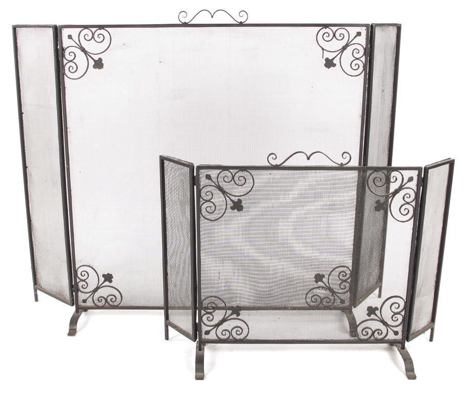 Appraisal: A large wrought iron triptych fire guard