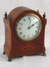 Appraisal: An Edwardian mahogany mantel clock with French balance wheel movement