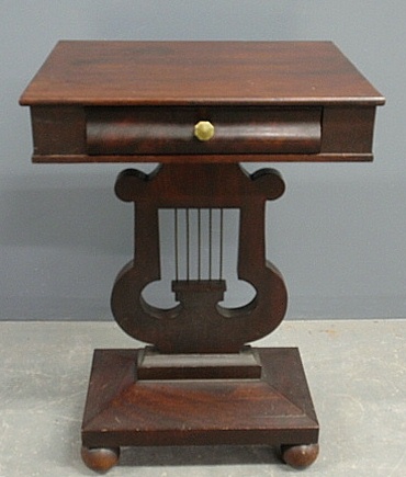 Appraisal: - Classical form Empire mahogany end table with lyre-form base