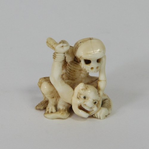 Appraisal: A Japanese carved ivory netsuke Meiji period depicting a skeleton