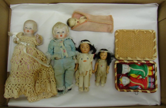 Appraisal: Lot of dolls Pair of painted bisque Indian dolls pair