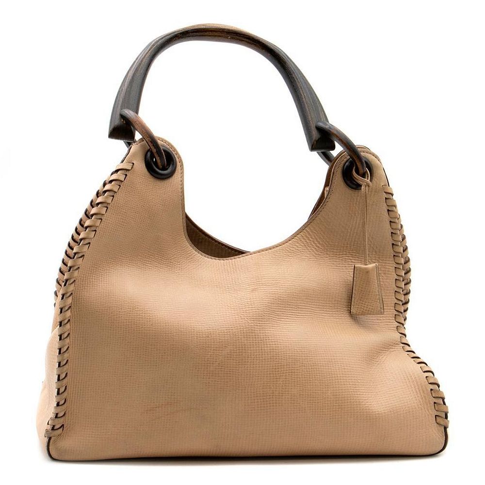 Appraisal: Gucci beige leather handbag with wood handle embossed patterened leather