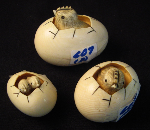 Appraisal: THREE IVORY NETSUKE in graduated sizes Hand carved eggs the