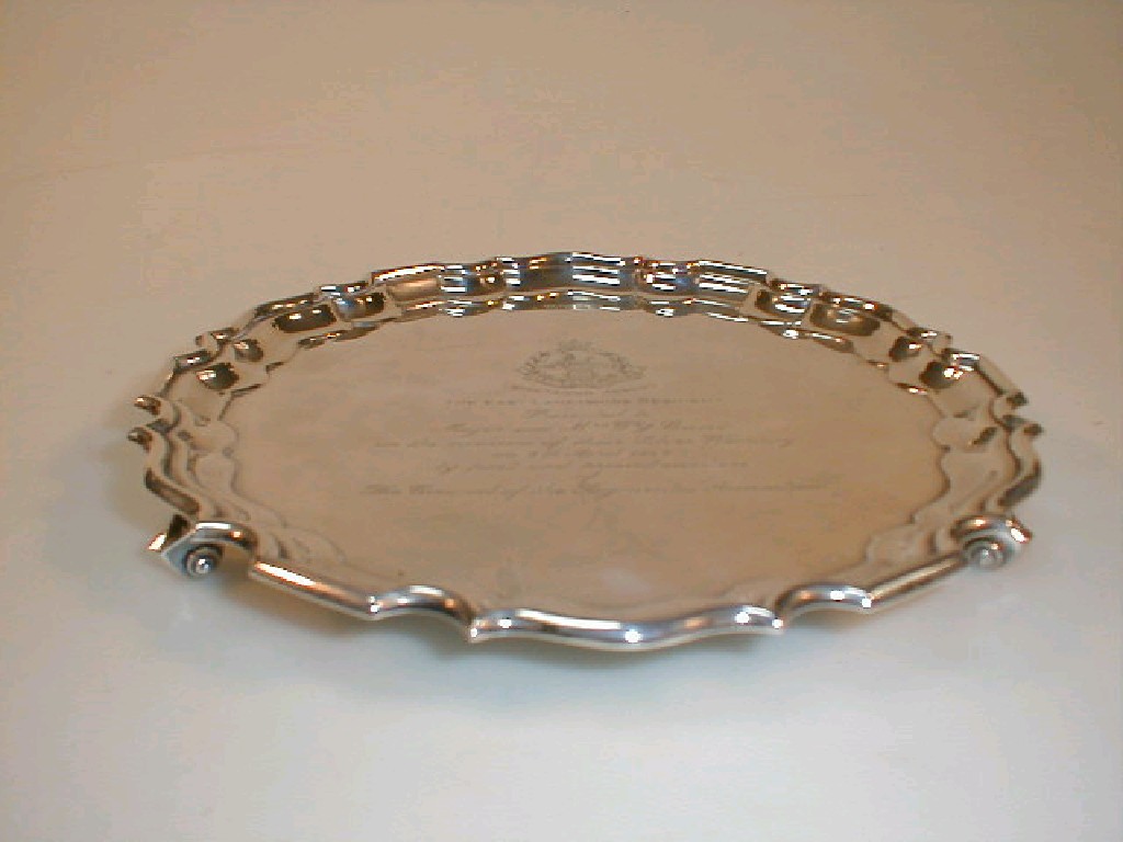 Appraisal: A silver salver by Walker Hall with a pie crust