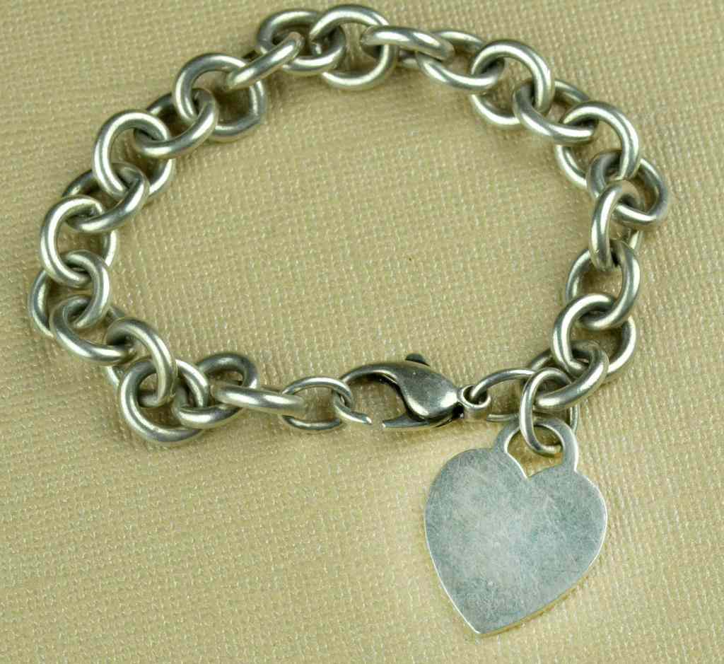 Appraisal: Tiffany Co Heart Charm BraceletWith a heart shaped pendant marked