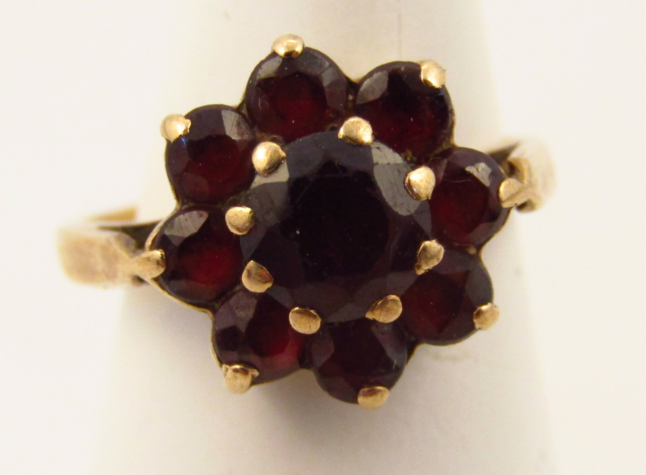 Appraisal: A ladies dress ring florally set with claw set garnets