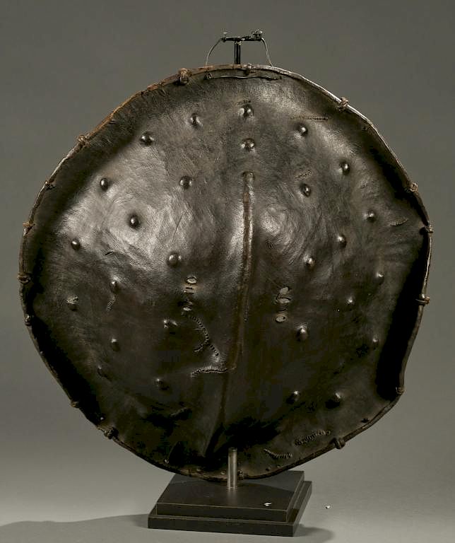 Appraisal: Ethiopian hide sheild th c A round elephant or rhino