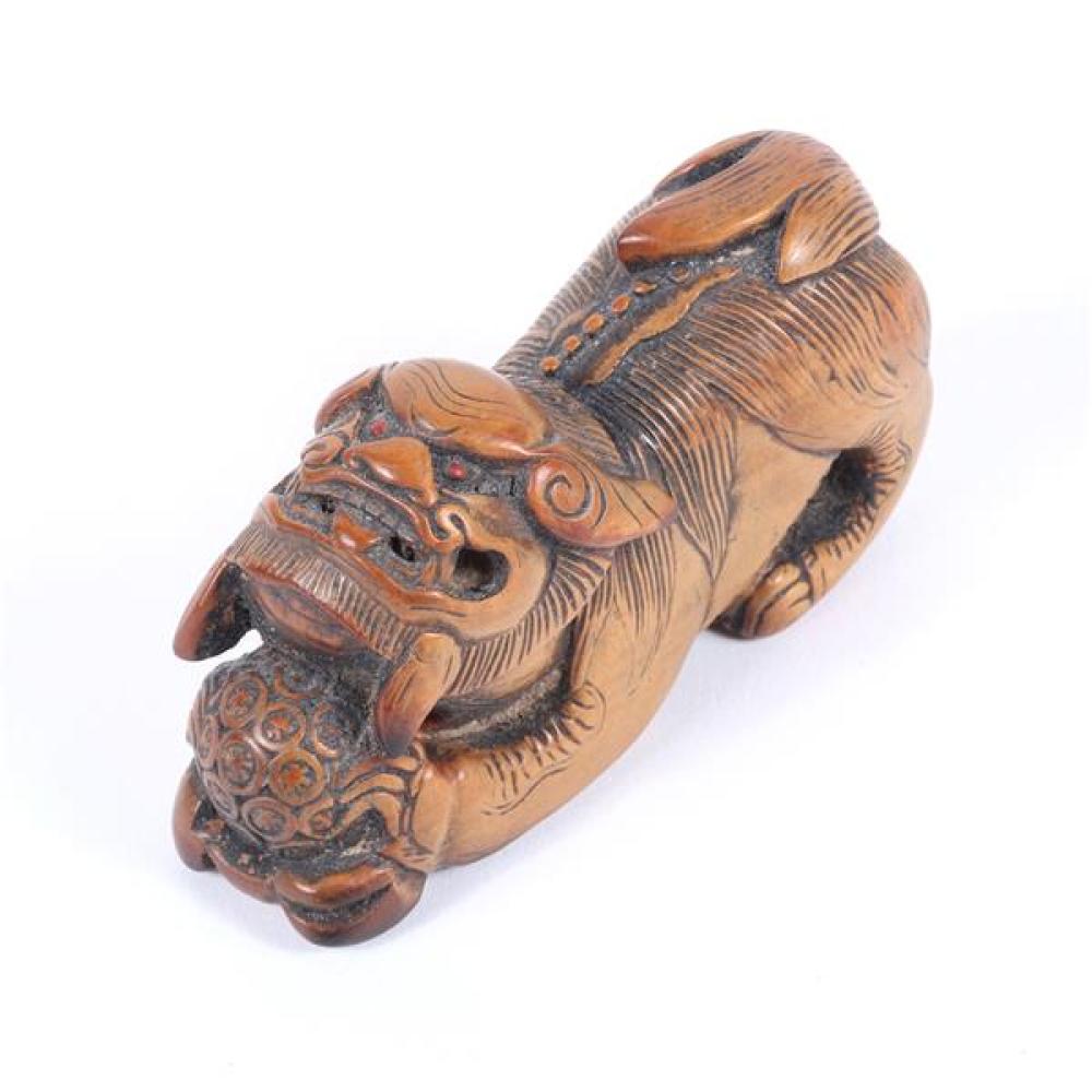 Appraisal: ANTIQUE JAPANESE MEIJI CARVED BOXWOOD FOO DOG ORNAMENT Antique Japanese