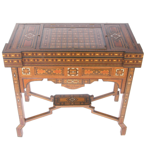 Appraisal: MOROCCAN GAME TABLE Wood game table inlaid with mother-of-pearl mid