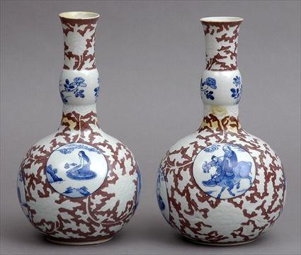 Appraisal: PAIR OF CHINESE BLUE AND WHITE PORCELAIN BOTTLE-FORM VASES Each