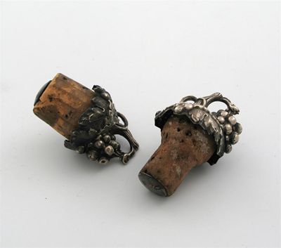 Appraisal: A pair of Victorian mounted bottle corks decorated with fruiting