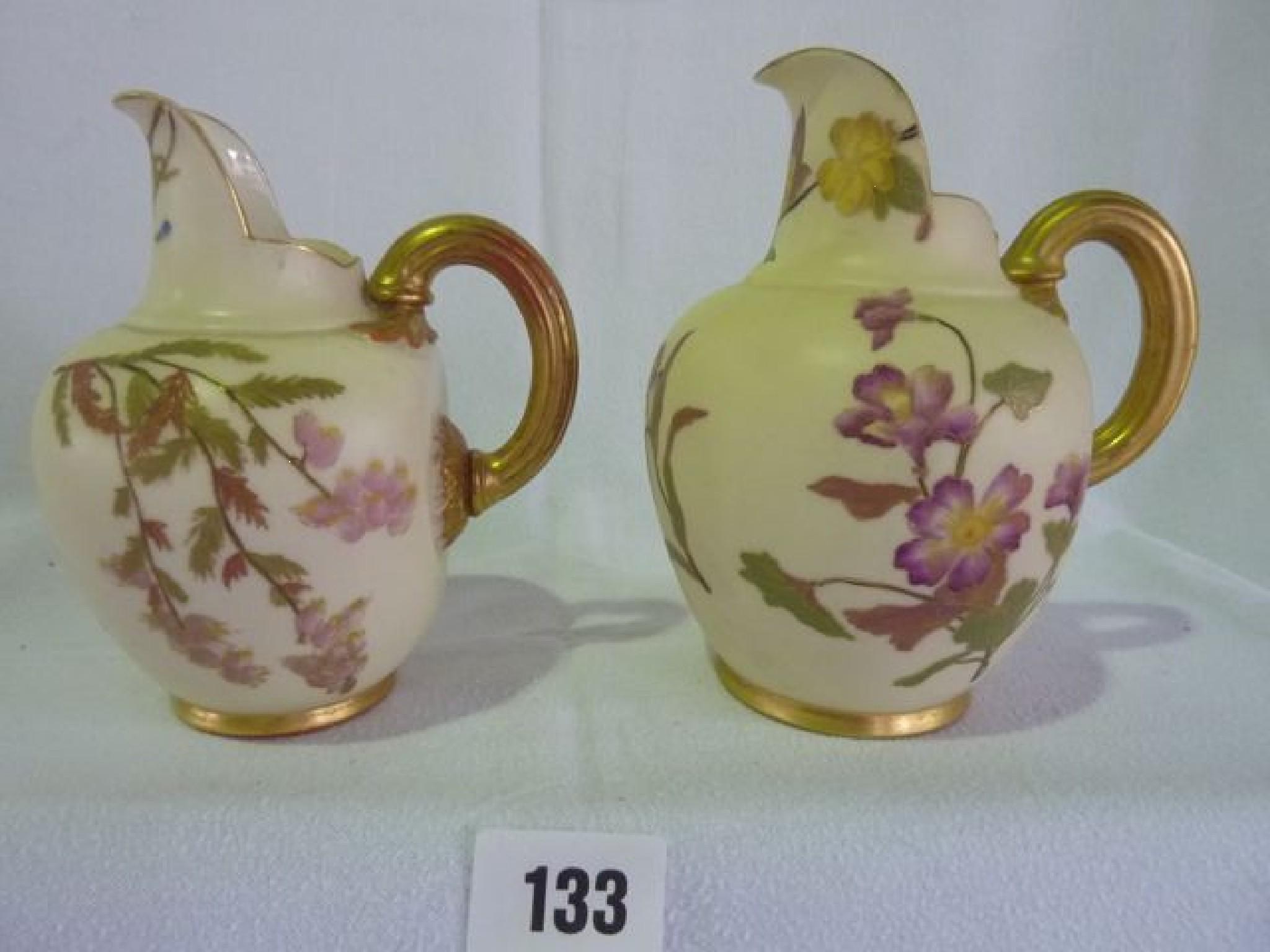 Appraisal: Two Royal Worcester Blush Ivory jugs hand painted with flowers