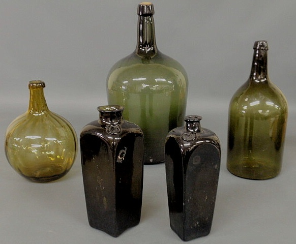 Appraisal: Five blown glass bottles th thc including two spirit examples