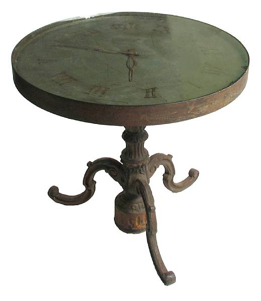 Appraisal: A clock form cast iron table height in diameter in