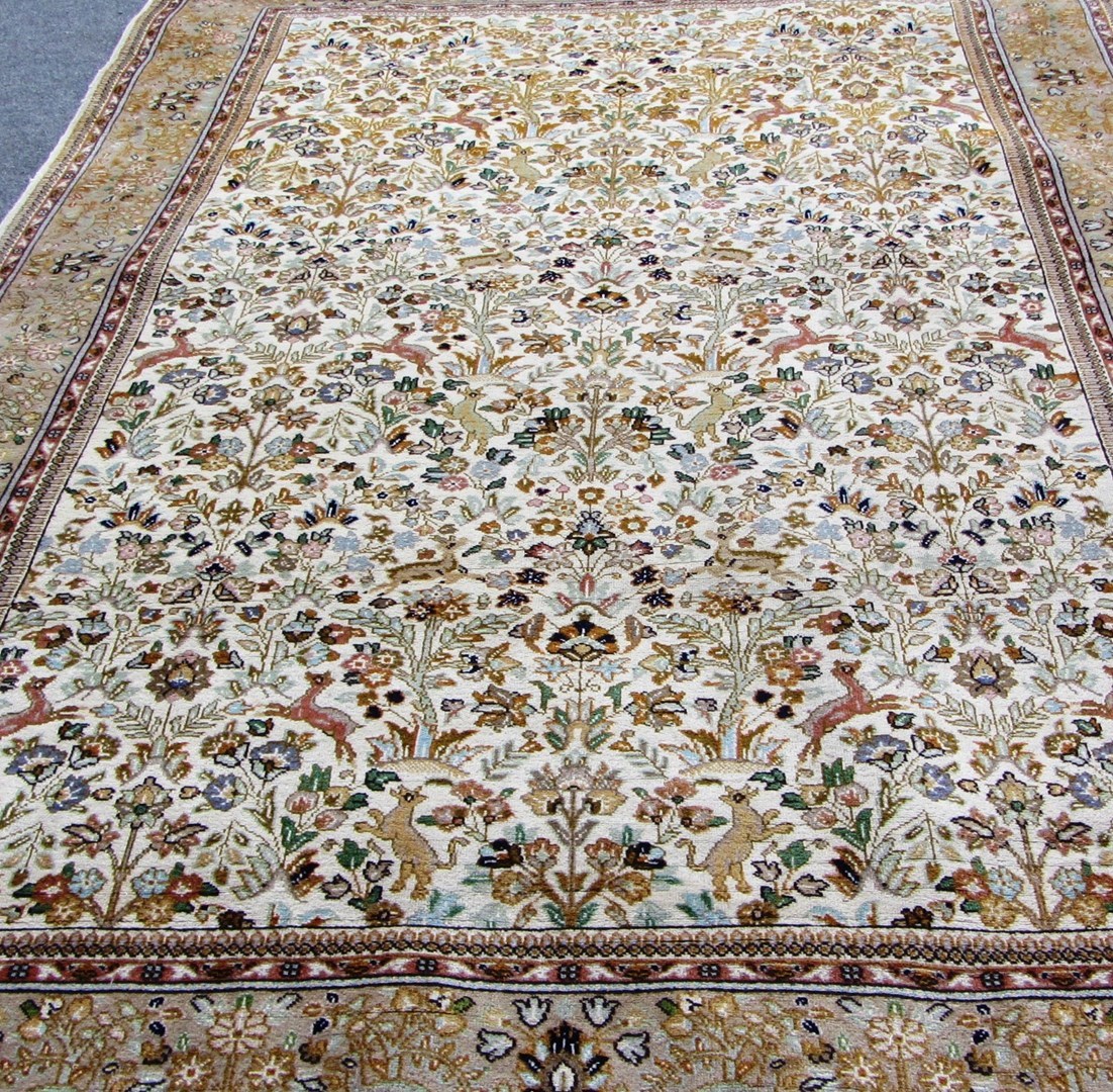 Appraisal: A Tabriz carpet Persian the ivory field with an allover