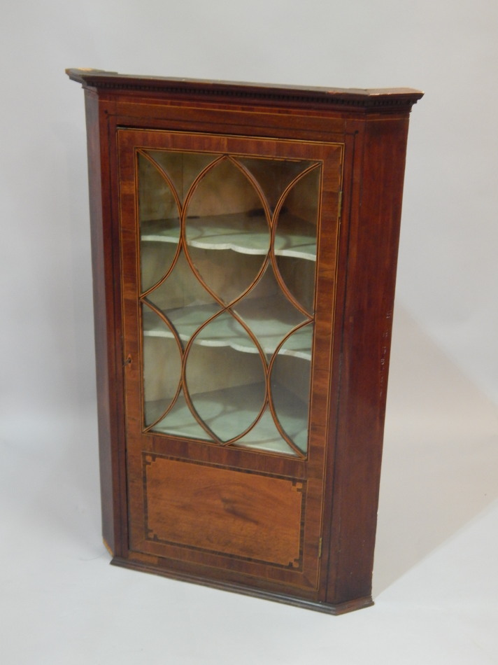 Appraisal: An early thC mahogany and boxwood strung corner cabinet with