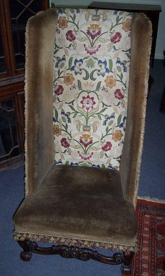 Appraisal: A high back wing chair of Carolean design having a