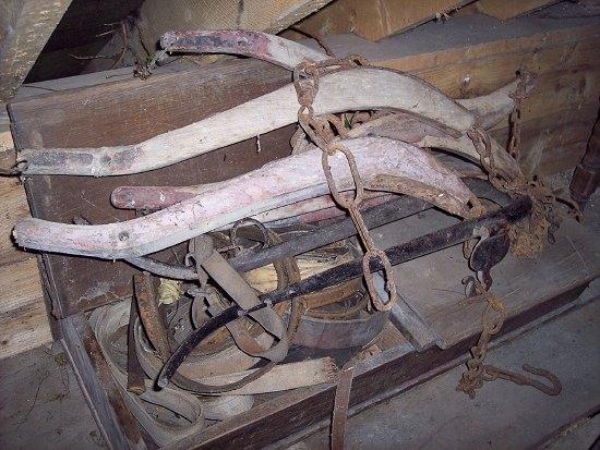 Appraisal: The upper section of a school desk containing sundry harness