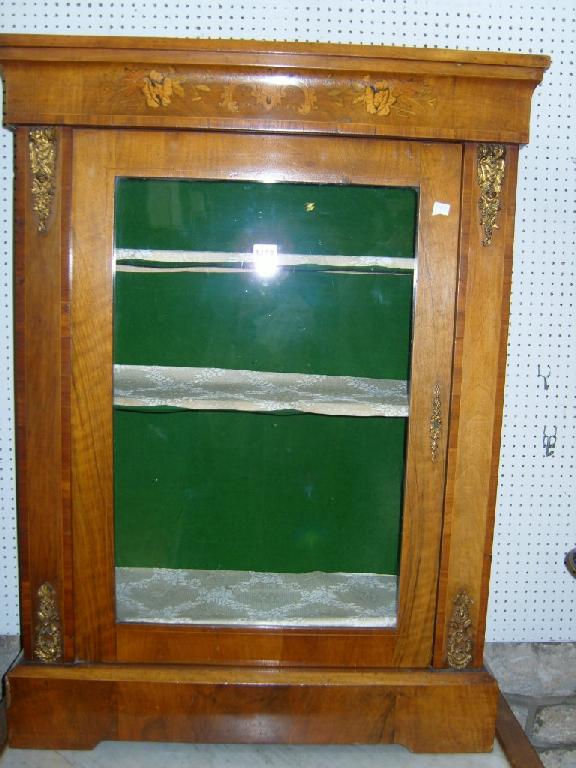 Appraisal: A Victorian walnut pier cabinet enclosed by a glazed panelled