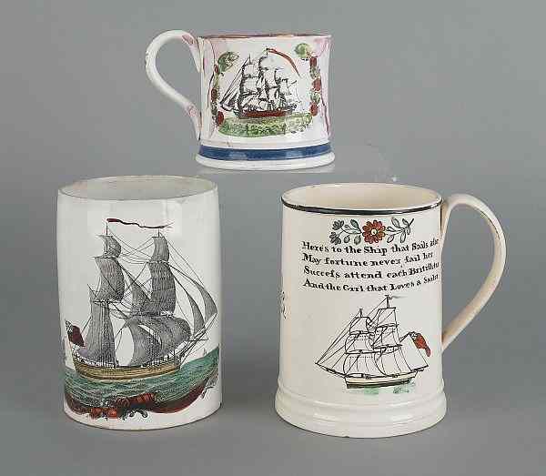 Appraisal: Three Staffordshire mugs of maritime interest early th c each