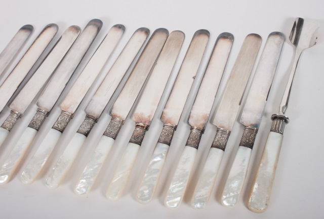 Appraisal: Twelve silver and pearl handled knives together with a similar