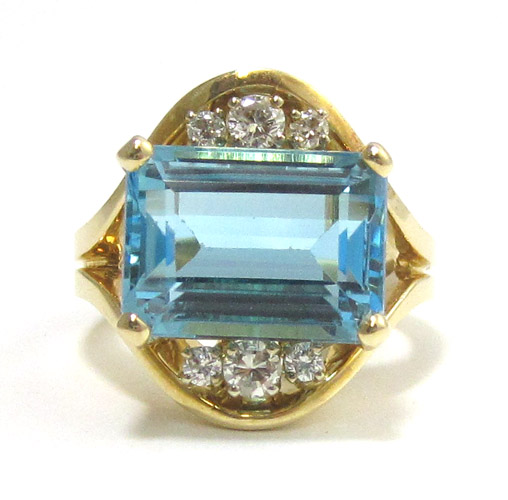 Appraisal: BLUE TOPAZ AND DIAMOND RING The k yellow gold ring