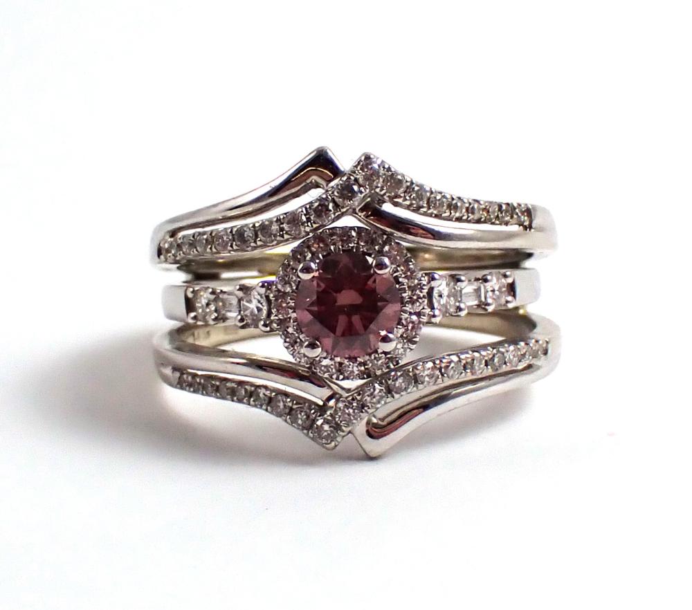 Appraisal: PINK DIAMOND AND FOURTEEN KARAT GOLD WEDDING RING ENSEMBLE with