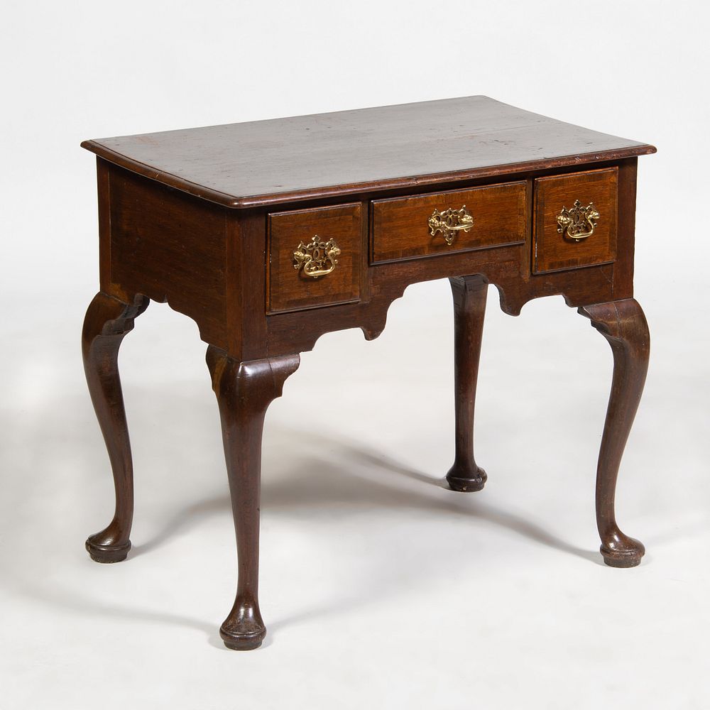 Appraisal: George II Mahogany Lowboy Fitted with one central drawer and