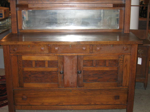 Appraisal: AMERICAN OAK ARTS CRAFTS SIDEBOARD with mirrored back splash three