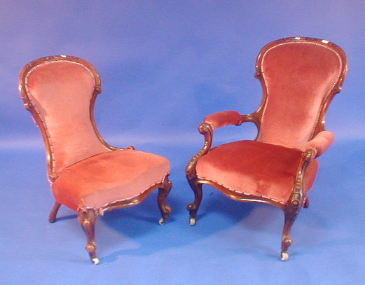 Appraisal: A Victorian carved walnut spoon back open armchair and nursing