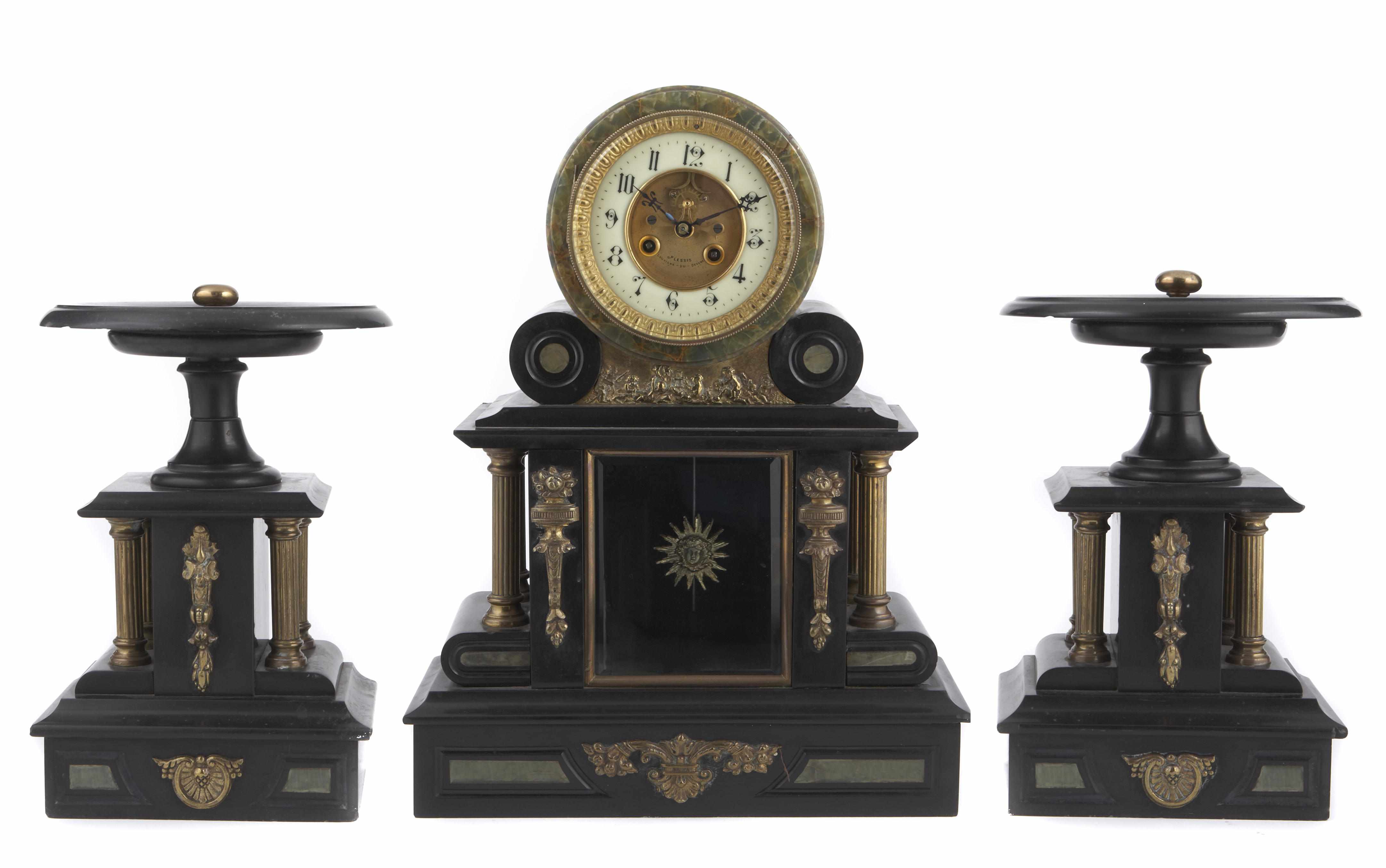 Appraisal: A French gilt metal mounted and black slate clock garniture