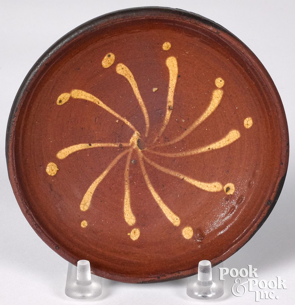 Appraisal: Pennsylvania or Maryland miniature redware plate Pennsylvania or Maryland miniature