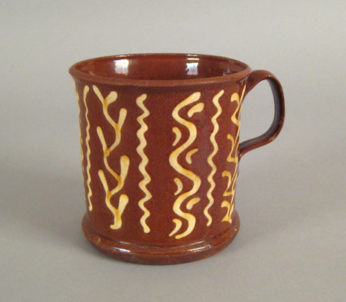 Appraisal: English redware mug early th c with yellow slip decoration