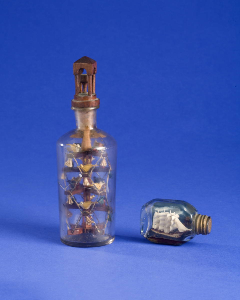 Appraisal: SAILOR'S FOLK-CARVED BIRD TREE IN A BOTTLE AND A MINIATURE